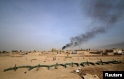 FILE - Mortars of the federal police forces are seen in the south of Mosul, Iraq, Nov, 9, 2016.