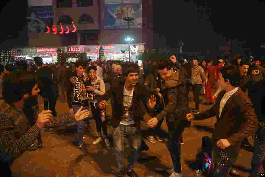 Iraqis celebrate during the New Year in Baghdad, Iraq, Jan. 1, 2018.