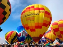 Hot air balloons are inflated during the annual Albuquerque International Balloon Fiesta in Albuquerque, N.M., Oct. 5, 2019.