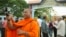 FILE - Luon Sovath, monk activist, is filming in front of Correctional Center 1 in the evening of 27th August, 2018 in Phnom Penh, Cambodia.