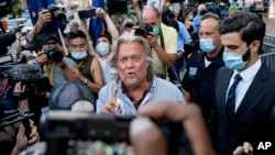President Donald Trump's former chief strategist Steve Bannon leaves federal court, Thursday, Aug. 20, 2020. He pleaded not guilty to charges of defrauding donors in an online fundraising scheme to build a southern border wall. (AP Photo/Craig Ruttle)
