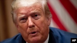 រូបឯកសារ៖ ប្រធានាធិបតីអាមេរិកលោក ដូណាល់ ត្រាំ ថ្លែងអំឡុងពេលកិច្ចពិភាក្សាតុមូលមួយជាមួយនឹងក្រុមអ្នកគាំទ្រជនជាតិអាមេរិកាំងកាត់អាហ្វ្រិកនៅសេតវិមាន កាលពីថ្ងៃទី១០ ខែមិថុនា ឆ្នាំ២០២០។