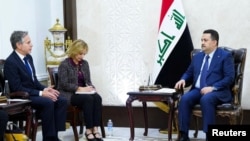 伊拉克总理穆罕默德·希亚·苏达尼(右)在巴格达会晤美国国务卿安东尼·布林肯(左)。