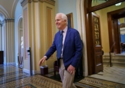 Sen. John Cornyn, R-Texas, departs the Senate chamber after final votes before the Memorial Day recess, at the Capitol in Washington, Friday, May 28, 2021.