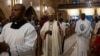 Archbishop of Kinshasa Fridolin Ambongo Besungu (C) arrives for a Christmas Mass at our Lady of the Congo Cathedral in Kinshasa on December 24, 2023. (Photo by Patrick Meinhardt / AFP)
