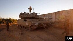 Israeli soldiers are positioned near the northern Israeli settlement of Shtula along the border with Lebanon, May 19, 2021. 