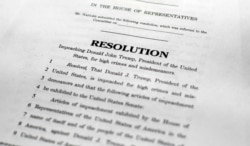 A copy of a page of the Articles of Impeachment is seen in Washington, Dec. 10, 2019.