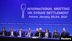 Delegates to the International Meeting on Syrian Settlement in Astana, Kazakhstan hold a news conference after talks ended on January 24, 2017. The meeting was organized by Russia, Turkey and Iran.