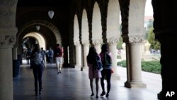 File -- Students walk on campus at Stanford University in Palo Alto, California in 2016.