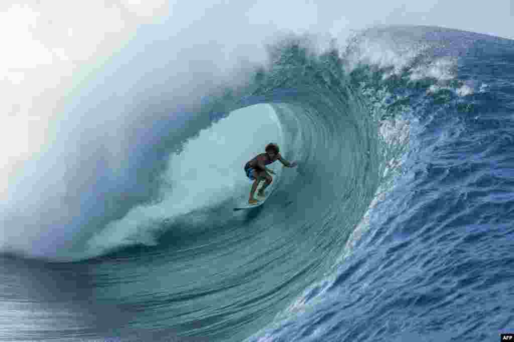 22 year-old Matahi Drollet surfs at Teahupoo off the coast of Tahiti in French Polynesia, May 11, 2020.