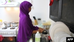 A refugee from Somalia, who had attempted suicide, doing kitchen chores at Camp Five on the Pacific island of Nauru, Sept. 2, 2018.