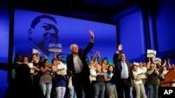 US Senator Bernie Sanders, left, and Democrat Greg Edwards, Pennsylvania's 7th District Congressional candidate, wave to supporters during a rally in Allentown, Pennsylvania, U.S. May 5, 2018.