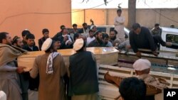 Afghan men carry the coffin of a victim of a deadly suicide attack in Kunar province, east of Kabul, Afghanistan, Saturday, Feb. 27, 2016. At least 10 civilians were killed Saturday morning when a suicide bomber on a motorcycle targeted on a local tribal leader near a park, an Afghan official said. The tribal leader Khan Jan was among those killed. (AP Photos/Mohammad Anwar Danishyar)