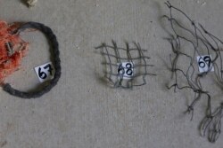 Pieces of net and other fishing gear are numbered before being cataloged at Hawaii Pacific University's Center for Marine Debris Research on Wednesday, May 12, 2021 in Kaneohe, Hawaii. (AP Photo/Caleb Jones)