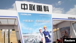 Police officers stand vigilant outside the U.S. embassy in London as the Senate Intelligence Committee prepares to release a report on the CIA's anti-terrorism tactics, Dec. 9, 2014.
