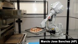 Zume Pizza in California is among many American businesses testing robots for food preparation. 