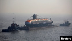 India's third Scorpene-class submarine INS Karanj is seen as a tugboat pulls it during its launch at the Mazagon Dock Ltd. naval shipbuilding yard, in Mumbai, India January 31, 2018.