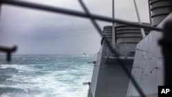 FILE - In this photo released by U.S. Navy, the guided-missile destroyer USS Higgins conducts joint operations with Royal Canadian Navy frigate HMCS Vancouver during routine operations in the Taiwan Strait, Oct. 20, 2024. (Trevor Hale/U.S. Navy via AP)