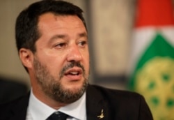 FILE - League party leader Matteo Salvini talks to reporters in Rome, Aug. 22, 2019.