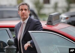 Michael Cohen, President Donald Trump's personal attorney, steps out of a cab during his arrival on Capitol Hill in Washington, Sept. 19, 2017.