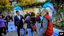 Los Angeles Unified Superintendent Alberto M. Carvalho greets students from Palisades Charter Elementary School upon their arrival at the Brentwood Elementary Science Magnet school in the Brentwood section of Los Angeles, Jan. 15, 2025.
