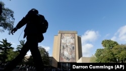 A double rainbow forms as people gather outside Buckingham Palace, following a statement from the Palace over concerns for Britain's Queen Elizabeth's health, in London, Britain. The Palace later announced the Queen's death.