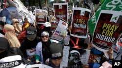 Muslim protesters rally outside China's embassy in Jakarta, Indonesia, Friday, Dec. 21, 2018. Several hundred protesters chanted "God is Great" and "Get out, communist!" outside China's embassy in the Indonesian capital, demanding an end to mass…