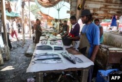This picture taken on Dec. 14, 2018 shows a view of a fish seller's stall at a market in the Huthi-held Red Sea port city of Hodeida.