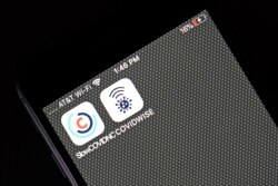 Covid notification apps for North Carolina, SlowCOVIDNC and Virginia, COVIDWISE are shown on a smart phone Friday, Dec. 4, 2020 in Raleigh, N.C. (AP Photo/Gerry Broome)