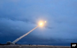 This video grab provided by RU-RTR Russian television via AP television, March 1, 2018, shows the launch of what President Vladimir Putin said is Russia's new nuclear-powered intercontinental cruise missile.