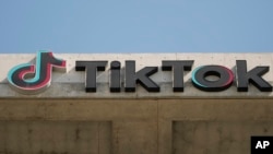 A TikTok sign is displayed on their building in Culver City, Calif., on March 11, 2024. (AP Photo/Damian Dovarganes, File)