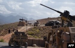 U.S. Army from NATO and Afghan commando forces are seen in a checkpoint during a patrol against Islamic State militants at the Deh Bala district in the eastern province of Nangarhar Province, July 7, 2018.
