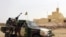 FILE - This file picture dated July 29, 2013 shows Malian soldiers patrolling in Kidal, northern Mali. 