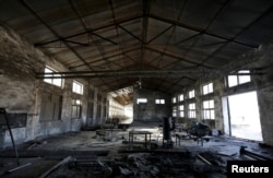 FILE - A closed brick factory building on the outskirts of Beijing, China, Jan. 18, 2016. By that point, Chinese manufacturing had ebbed to its lowest in more than three years.