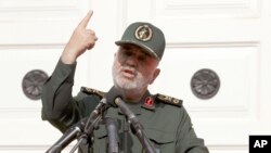 Chief of Iran's Revolutionary Guard Gen. Hossein Salami speaks in a ceremony to unveil new anti-U.S. murals painted on the walls of former U.S. embassy in Tehran, Iran, Saturday, Nov. 2, 2019. 