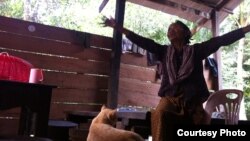 This photo taken last week shows Im Chaem sitting at her home in Anlong Veng, a former Khmer Rouge stronghold in northern Cambodia, and refusing to follow an indictment to appear at the Khmer Rouge tribunal. (Courtesy of Documentation Center of Cambodia)
