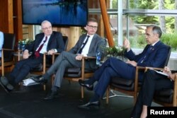 Governor of the Bank of England Mark Carney speaks on a panel with former Prime Minister of Canada Paul Martin, left, and former Senior Deputy Governor of the Bank of Canada Tiff Macklem during the G-7 Finance Ministers and Central Bank Governors meeting in Whistler, British Columbia, Canada, May 31, 2018.