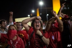Supporters of President Dilma Rousseff shout during clashes with the police outside Congress, in Brasilia, Brazil, May 11, 2016.