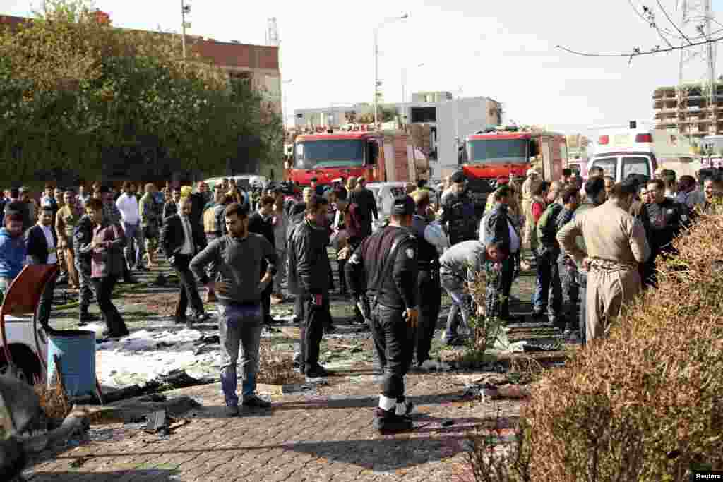 Crowds survey the area around a car bomb attack in Irbil, Nov. 19, 2014.