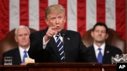 President Donald Trump addresses a joint session of Congress on Capitol Hill in Washington, Feb. 28, 2017. Vice President Mike Pence and House Speaker Paul Ryan of Wisconsin listen. (Jim Lo Scalzo/Pool Image via AP) 