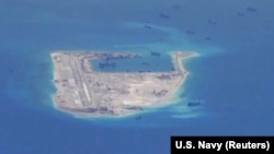 Chinese dredging vessels are purportedly seen around Fiery Cross Reef in the disputed Spratly Islands in the South China Sea.