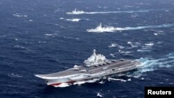 China's Liaoning aircraft carrier with accompanying fleet conducts a drill in an area of South China Sea, in this undated photo taken December 2016. 