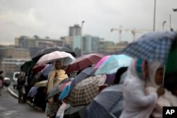 ዝናብ በአዲስ አበባ እየዘነበ እ.አ.አ. 2012 /ፋይል ፎቶ - አሶሽየትድ ፕረስ/