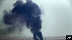 Reporteros de AP tomaron esta otra foto de Ras al Ayn desde el poblado fronterizo de Ceylanpinar, en Turquía.