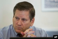 FILE - Phil Robertson, deputy director of Human Rights Watch's Asia division, attends a press conference in Phnom Penh, Cambodia, March 12, 2015.