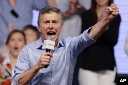 Opposition candidate Mauricio Macri celebrates after winning a runoff presidential election in Buenos Aires, Argentina, Sunday, Nov. 22, 2015.