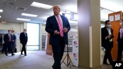 President Donald Trump walks after casting his ballot in the presidential election, in West Palm Beach, Florida, Oct. 24, 2020. 