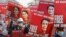 Demonstrators hold placards with the image of Aung San Suu Kyi during a protest against the military coup, in Naypyitaw, Myanmar, Feb. 17, 2021.