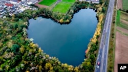 A lake in the shape of a heart is visible in Rodgau, near Frankfurt, Germany, Oct. 12, 2024. 