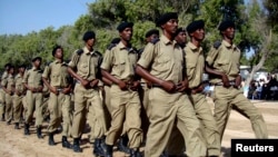  FILE - Somali police march during a ceremony in Mogadishu, Dec. 20, 2008. The ceremony marked 65 years since the academy was established in 1943. 